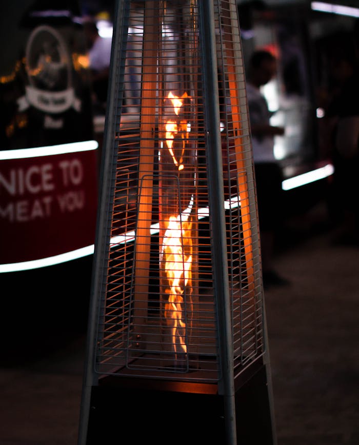 A mesmerizing photo of a patio heater's flames, creating warmth and ambiance in an outdoor setting.
